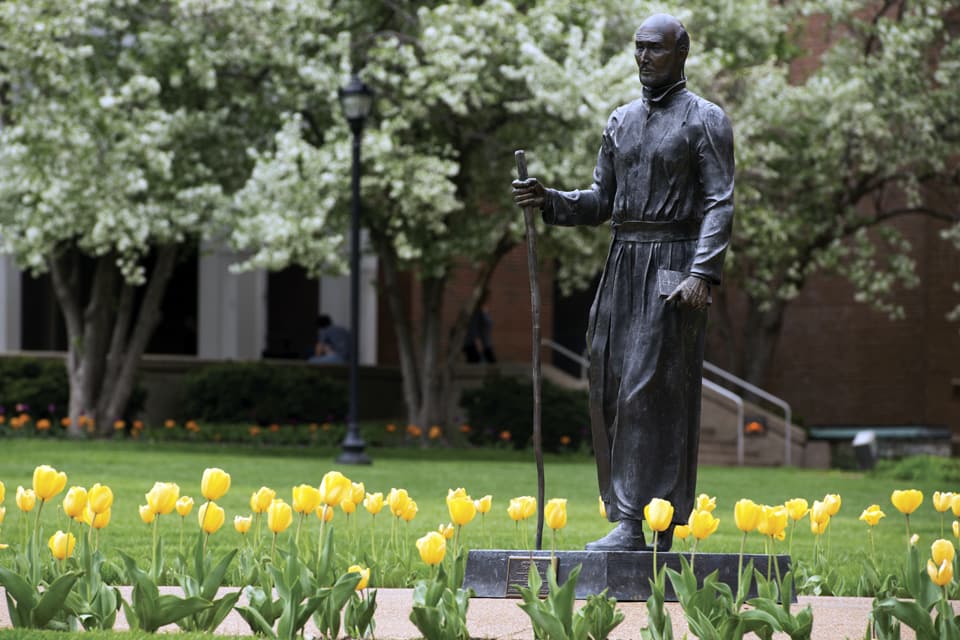 St. Ignatius The statue of St. Ignatius on SLU's quad surrounded by tulips