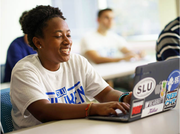 SLU student with laptop