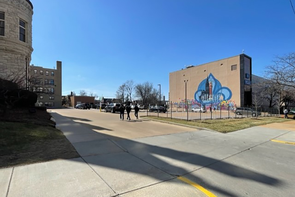 Exterior Morrissey Hall and John Carroll parking lot with the colorful mural visible.