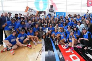 The Billiken women's basketball team poses after an A-10 win
