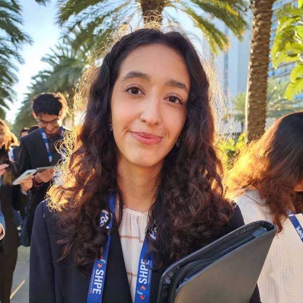 Aryana Yazdi smiling in a professional headshot.