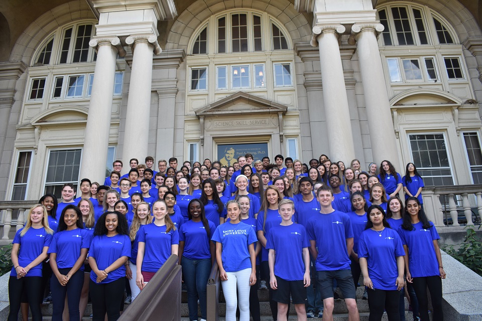 AIMS Workshop Attendees A group of about 60 AIMS summer workshop participants standing on the stairs posed for a group photo