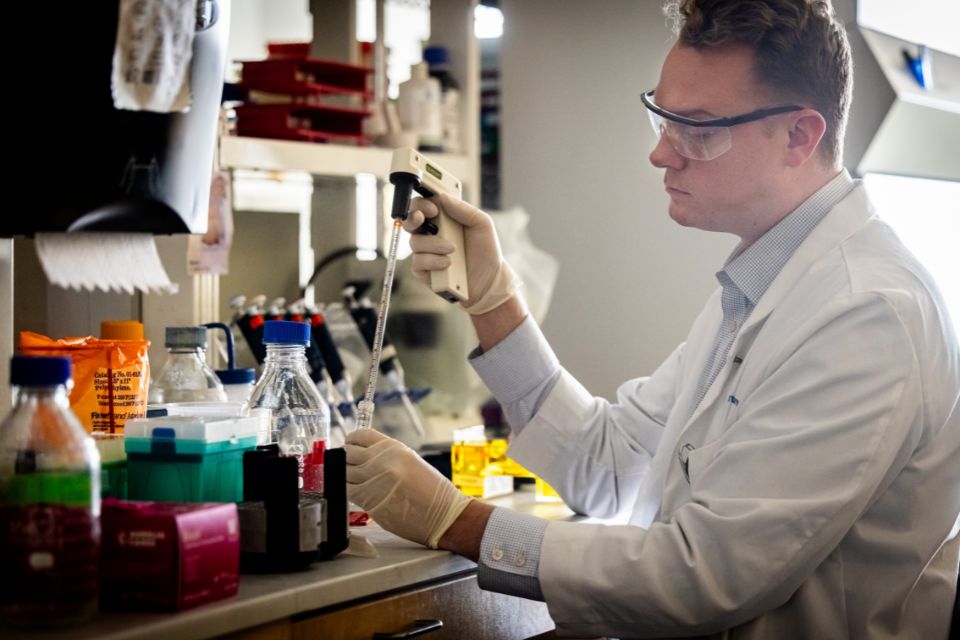 A student works in a Doisy Research Center lab