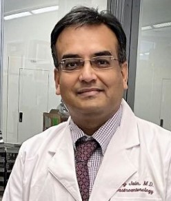 Ajay Jain, M.D. man in labcoat