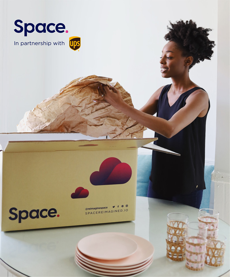 Space Storage Ad Young woman packing dishes into a storage box
