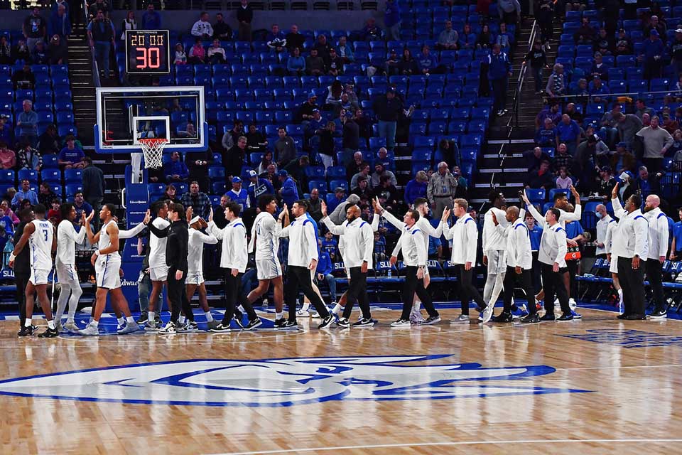 Men's Stats SLU mens basketball players on the court pre-game