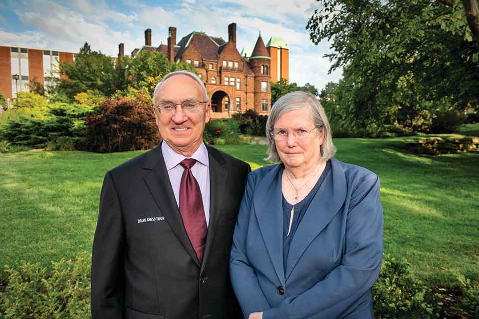 A photograph of Rex and Jeanne Sinquefield outside of the Samuel Cupples House on SLU’s campus.