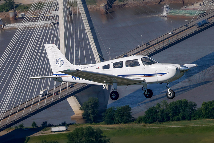 Archer over bridge SLU plane flying over bridge in downtown St. Louis