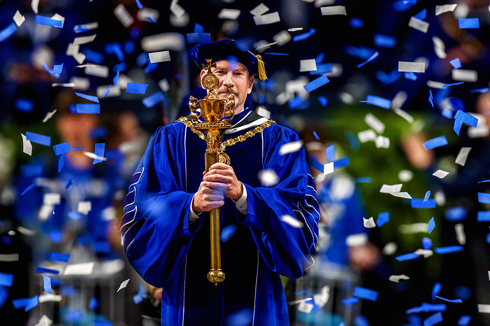 Ed Feser Dr. Ed Feser carries SLU's presidential mace during his inauguration in November 2025.